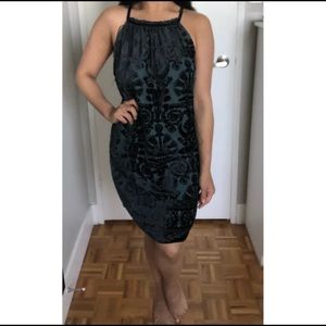 Green cocktail dress with black velvet detailing